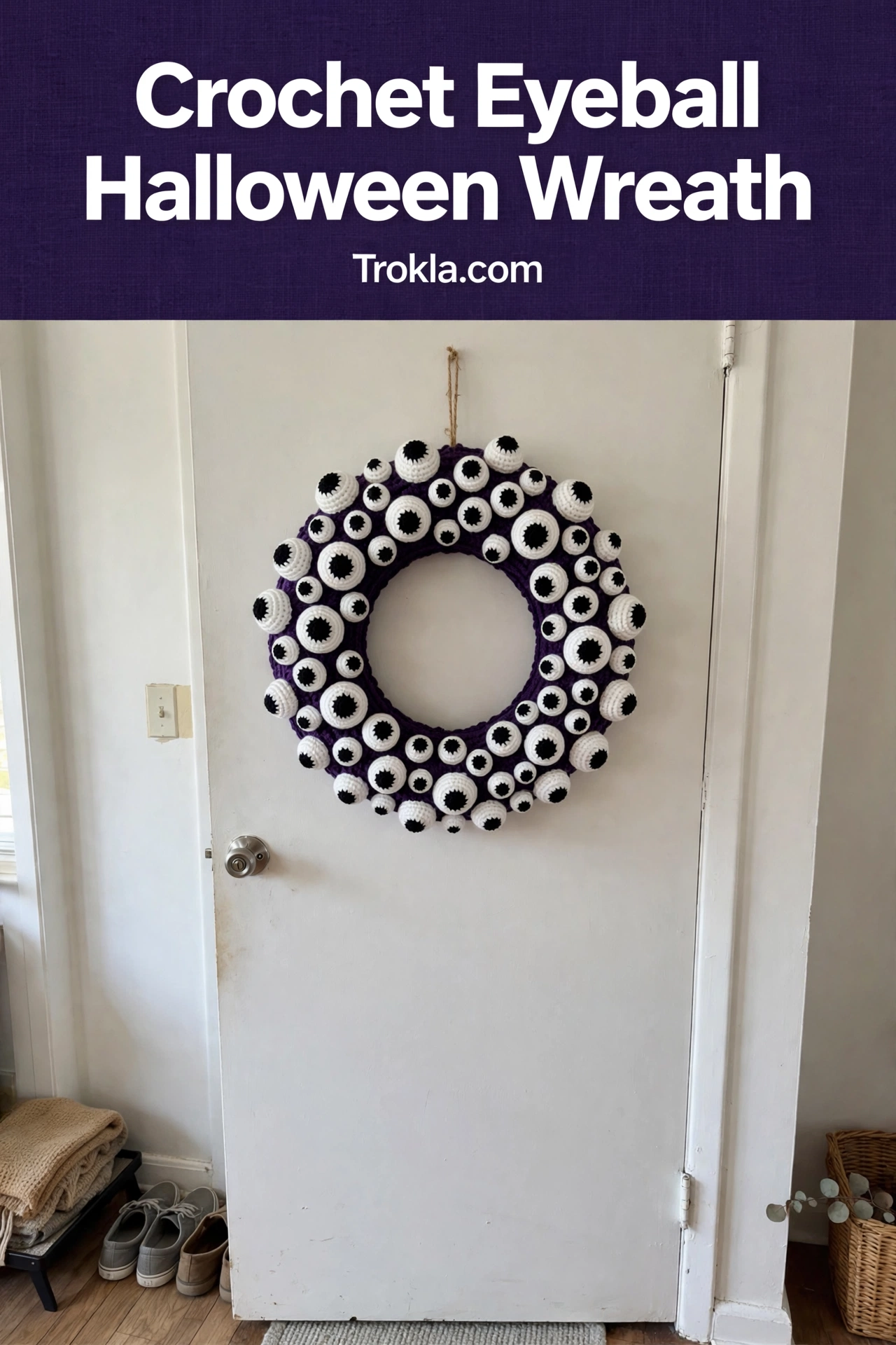 Crocheted wreath covered in different-sized eyeballs