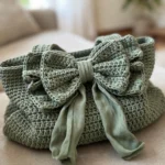 Sage green bow handbag handle detail