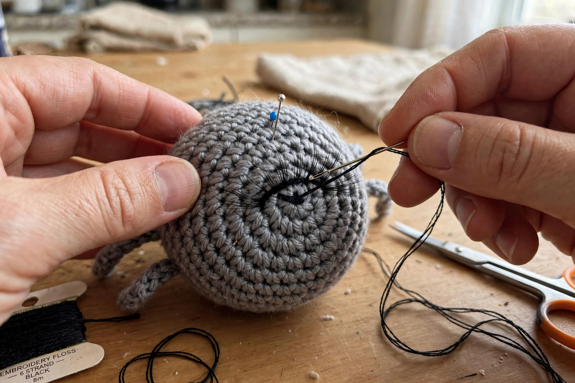 Embroidering Sharlotte's sweet eyes and lashes