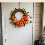 Simple Halloween wreath with crocheted pumpkins