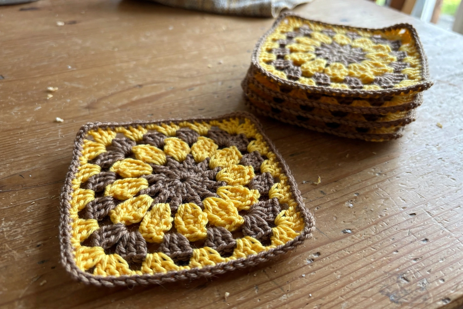 Sunflower granny square with brown center and gold petals