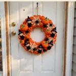 Trick or treat Halloween wreath with witches, webs, spiders and pumpkins